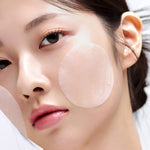 Model applying House of Hur Clearing Skin Prep Essence Pad to che