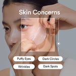 Close up of a person applying a translucent Abib eye patch to target wrinkles and dark spots.