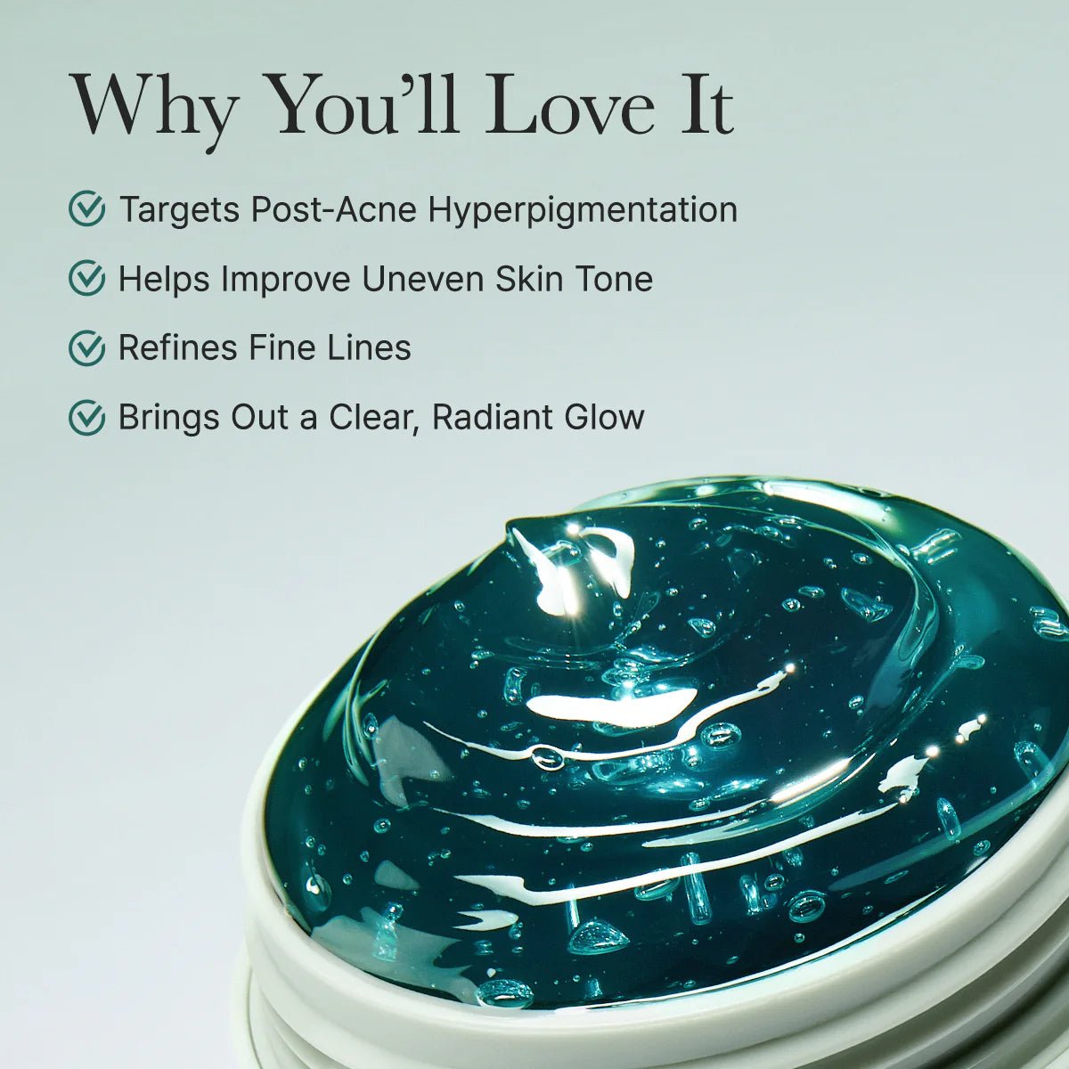 Close-up of the serum's unique jewel-toned gel texture inside the jar, highlighting its radiant, watery glow.