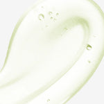 Close-up texture shot of a clear, lightweight, and cooling gel-like serum with small air bubbles.