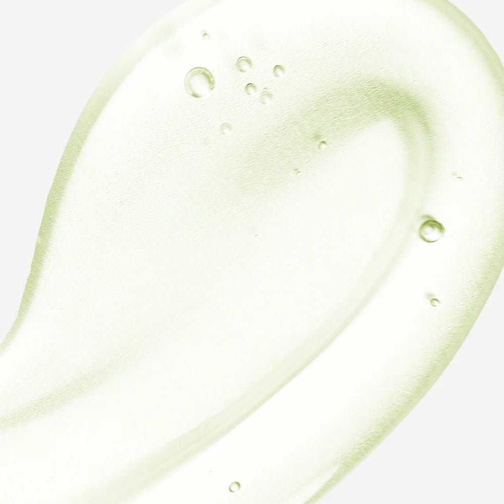Close-up texture shot of a clear, lightweight, and cooling gel-like serum with small air bubbles.
