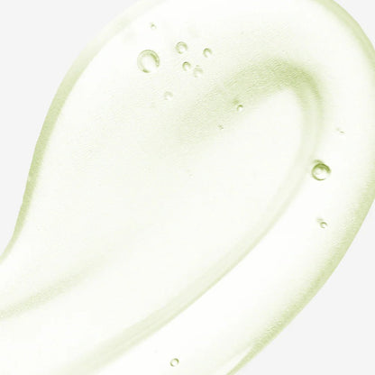 Close-up texture shot of a clear, lightweight, and cooling gel-like serum with small air bubbles.