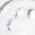Close-up of Celimax Jojoba Cleansing Oil emulsifying into a white milky texture for deep pore cleansing.