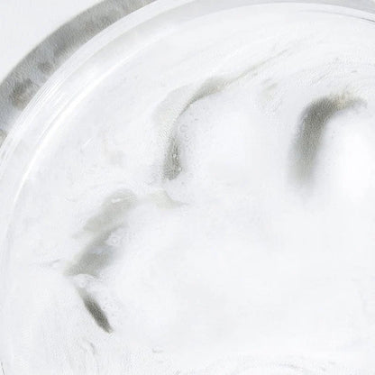 Close-up of Celimax Jojoba Cleansing Oil emulsifying into a white milky texture for deep pore cleansing.