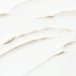 Close-up of a white ceramic tile with subtle wave pattern