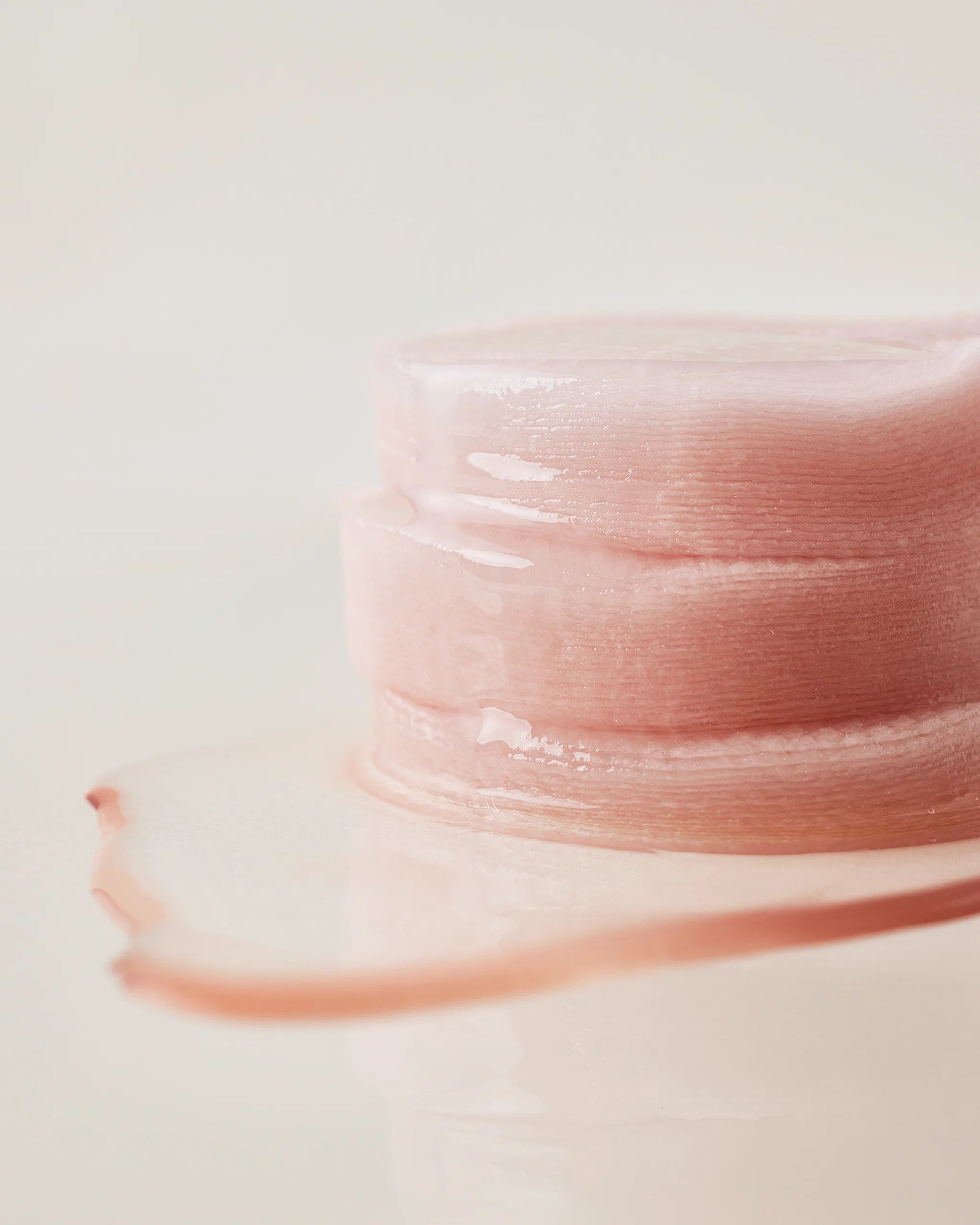 Close-up of a stack of moisture-soaked House of Hur essence pads.