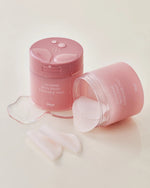 Pink jar of House of Hur Clearing Skin Prep Essence Pads with spilled essence.