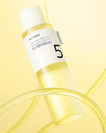Aesthetic view of numbuzin No.5 Vitamin Boosting Essential Toner bottle highlighting Glutathione.