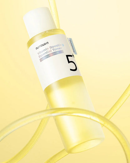 Aesthetic view of numbuzin No.5 Vitamin Boosting Essential Toner bottle highlighting Glutathione.