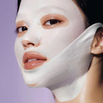 Close-up of a model wearing the Numbuzin No.9 lifting band for a defined facial contour.