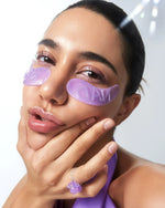 Model wearing Numbuzin No.9 purple hydrogel patches for a refreshed, glowing look.