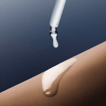 Applying Skin1004 Hyalu-Teca Plumping serum with a glass dropper.